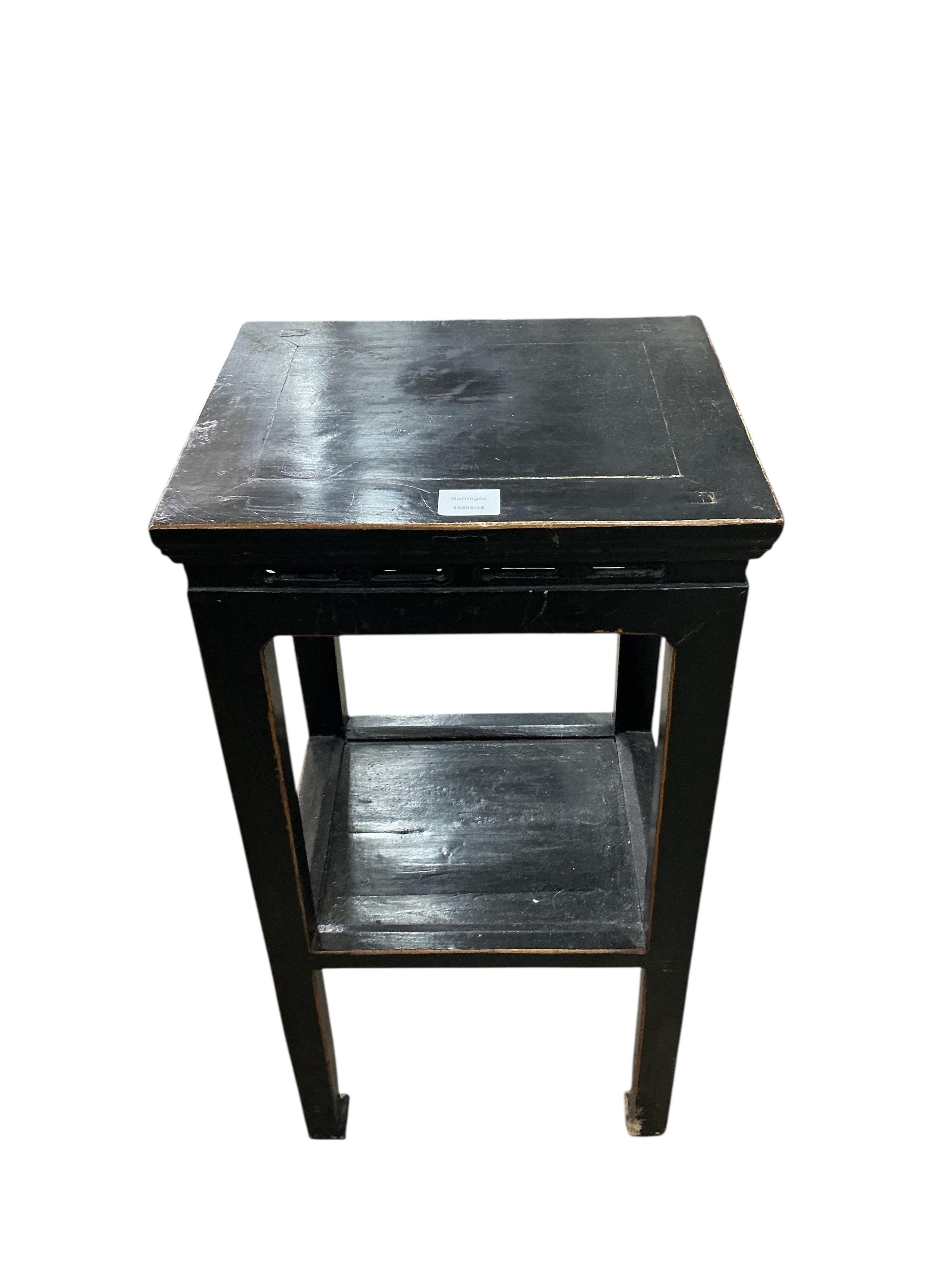 A pair of Chinese lacquer two tier tables, width 41cm, depth 34cm, height 79cm, Provenance: The late Kenneth Turner (1936-2025), celebrity florist, designer and perfume retailer, he received the Royal Warrant from the Pr